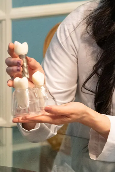 model of a dental implant being installed